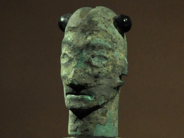 Bronze mask with horns